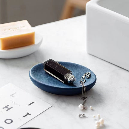 Vit oval tvålkopp med dräneringshål