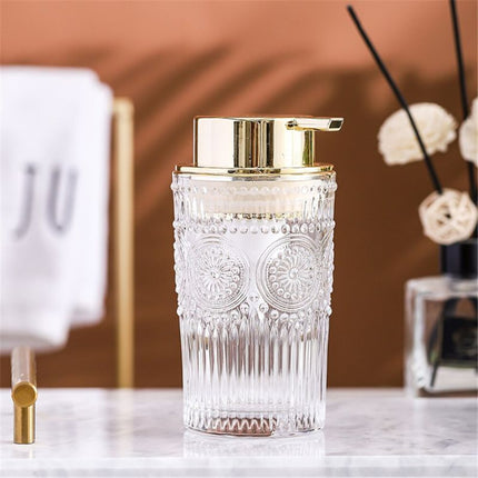 Glastvålpump med guldpump och mönster