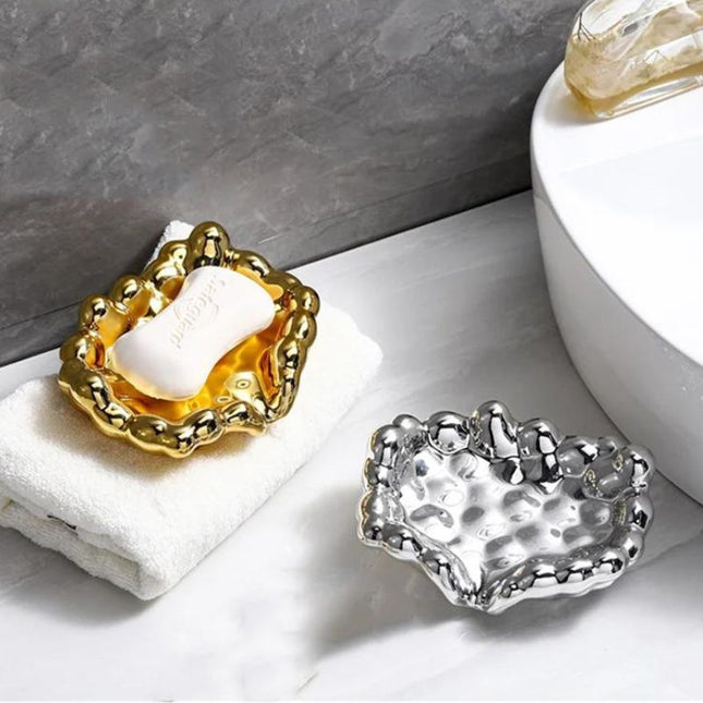 Guldfärgad lyxig tvålkopp i molndesign