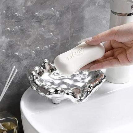 Guldfärgad lyxig tvålkopp i molndesign