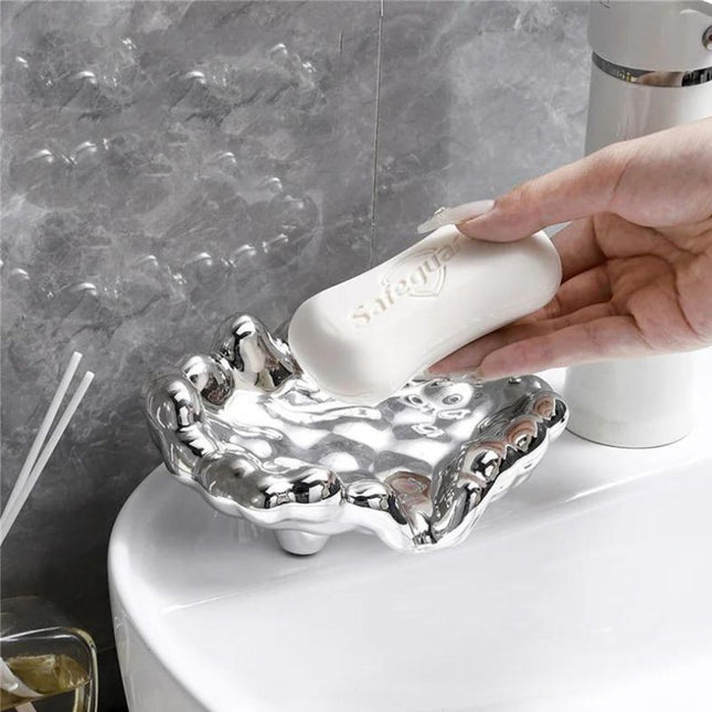 Guldfärgad lyxig tvålkopp i molndesign