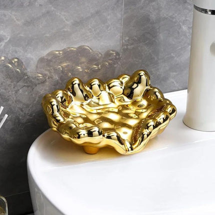Guldfärgad lyxig tvålkopp i molndesign
