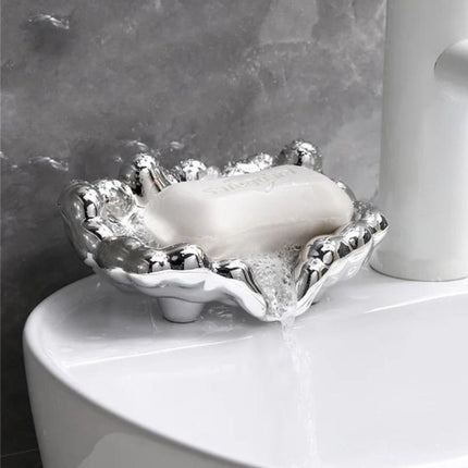 Guldfärgad lyxig tvålkopp i molndesign