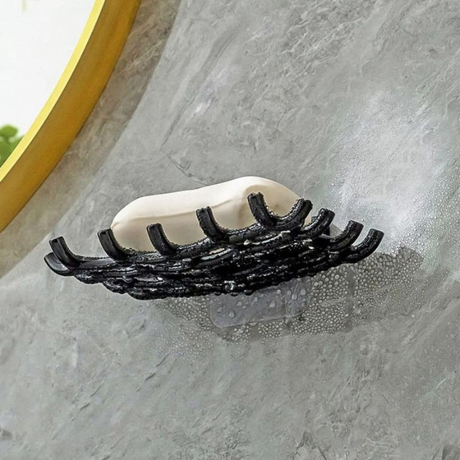 Väggmonterad dränerande tvålhållare