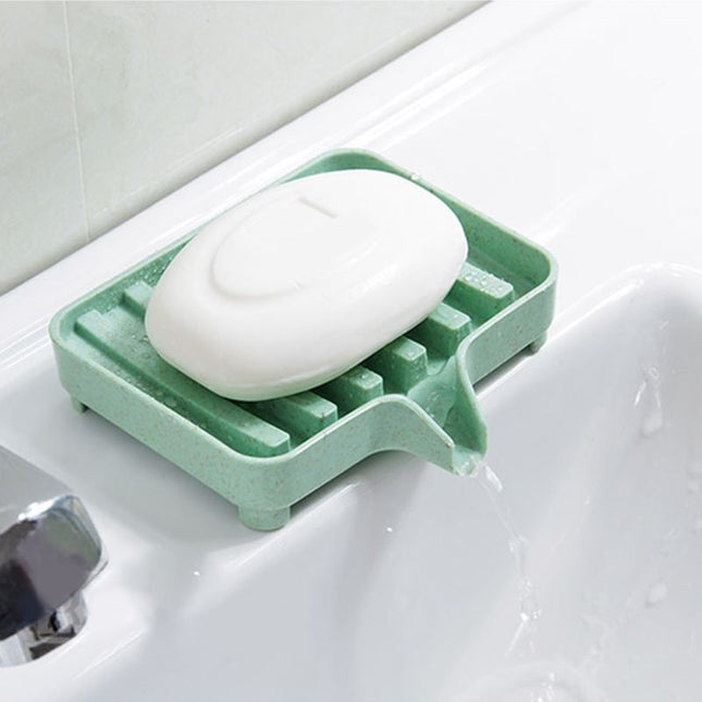 Dränerande tvålkopp i plast för diskbänk